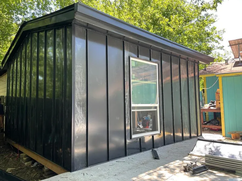 Black standing seam metal wall panels for Roof Inspection in McCalla